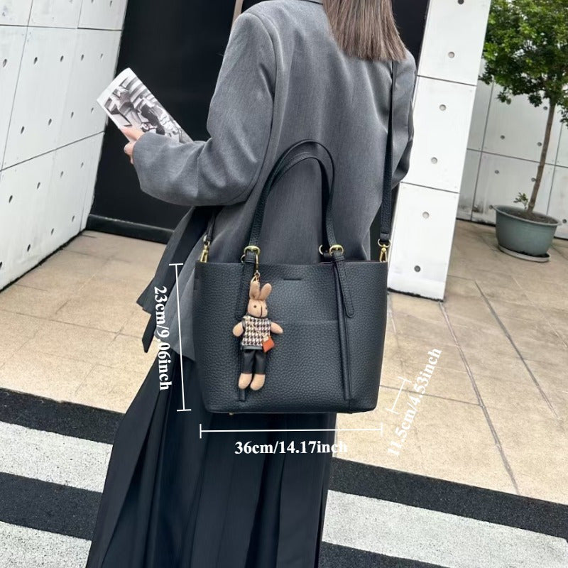 Gentle Beige Tote Bag, with a Playful Bear Charm, Demonstrating a Sweet Style