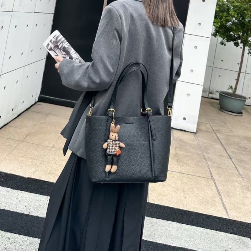 Gentle Beige Tote Bag, with a Playful Bear Charm, Demonstrating a Sweet Style